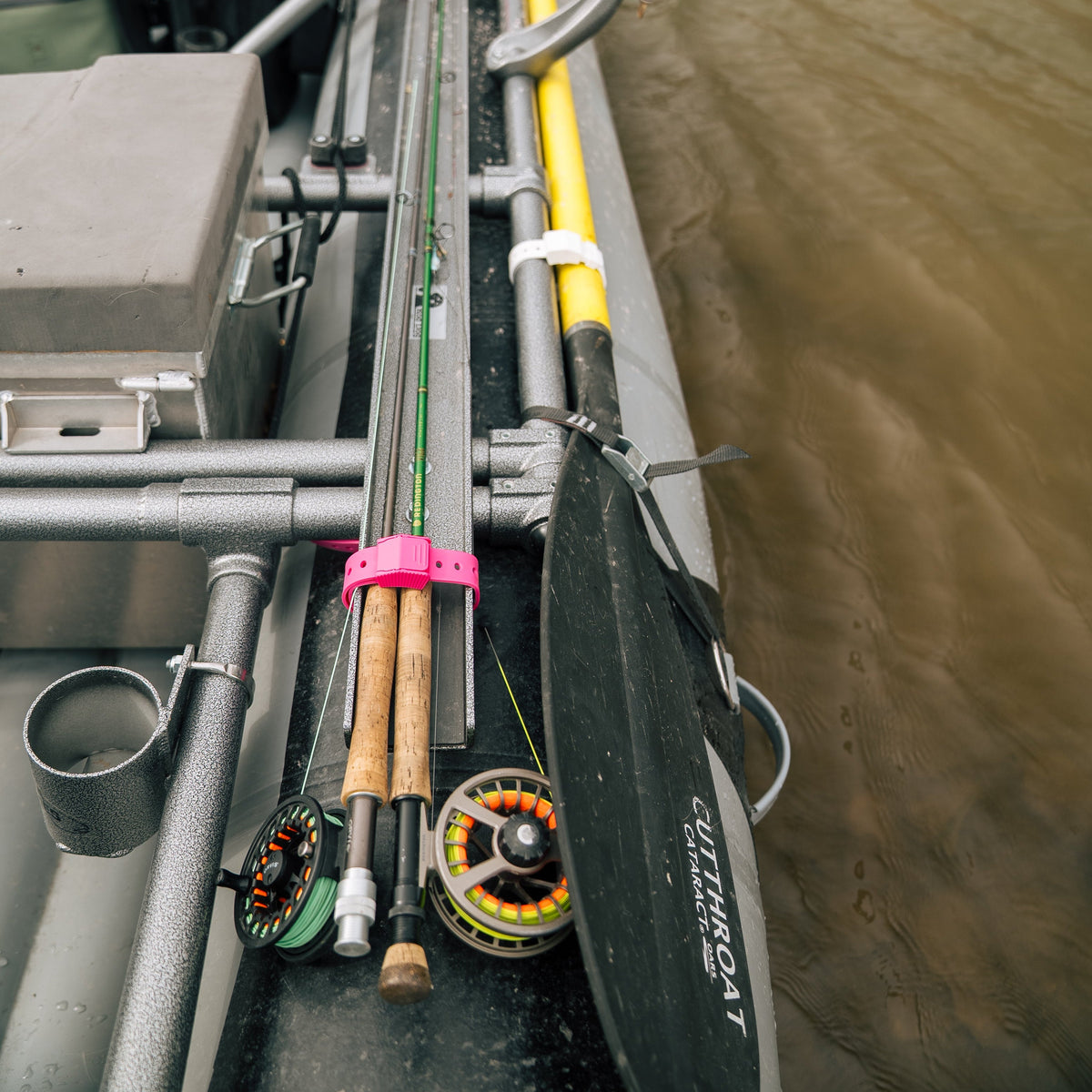 Fishing equipment on a boat with a blurred water background