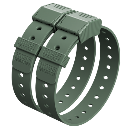 Two green straps with plastic buckles on a white background