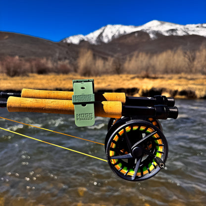 Fly fishing rod and reel with a mountainous landscape in the background